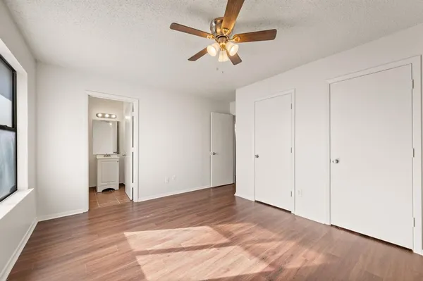 a view of livingroom with hardwood floor and a ceiling fan