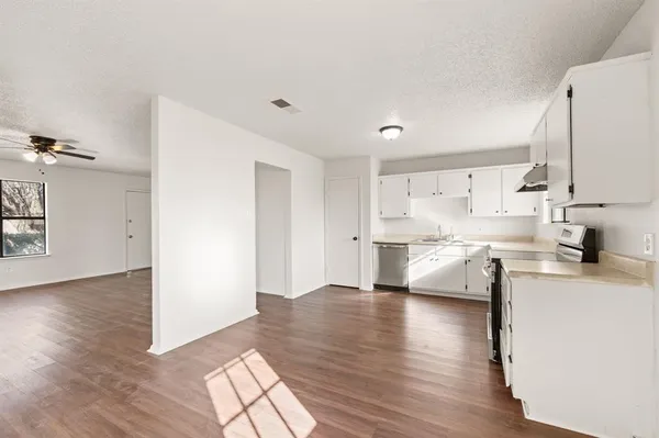 a view of kitchen with wooden floor