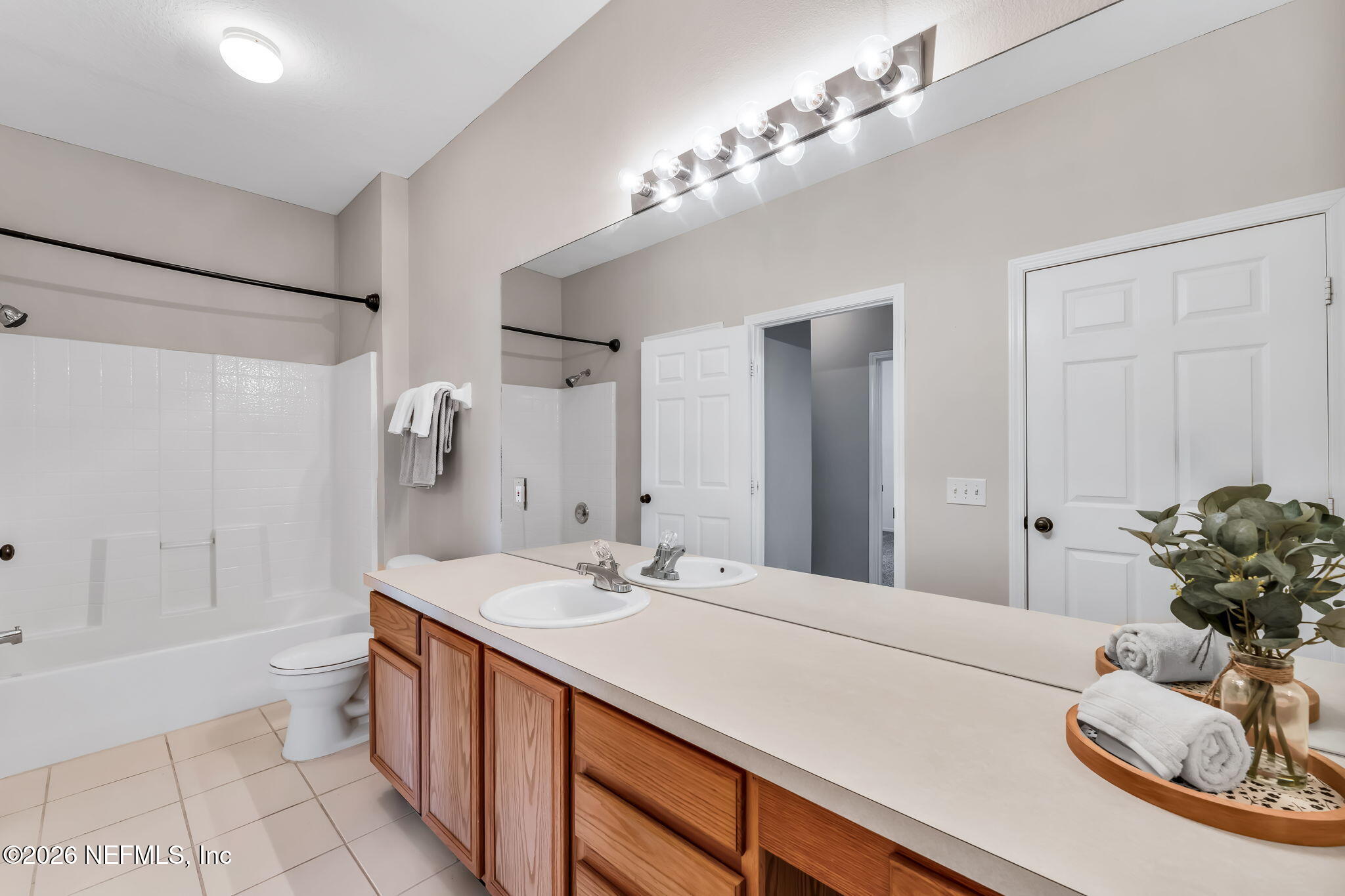 7990 Baymeadows Road East, Unit 520 Jacksonville, FL 32256 - Photo 23 of 41 a bathroom with a sink a toilet and shower