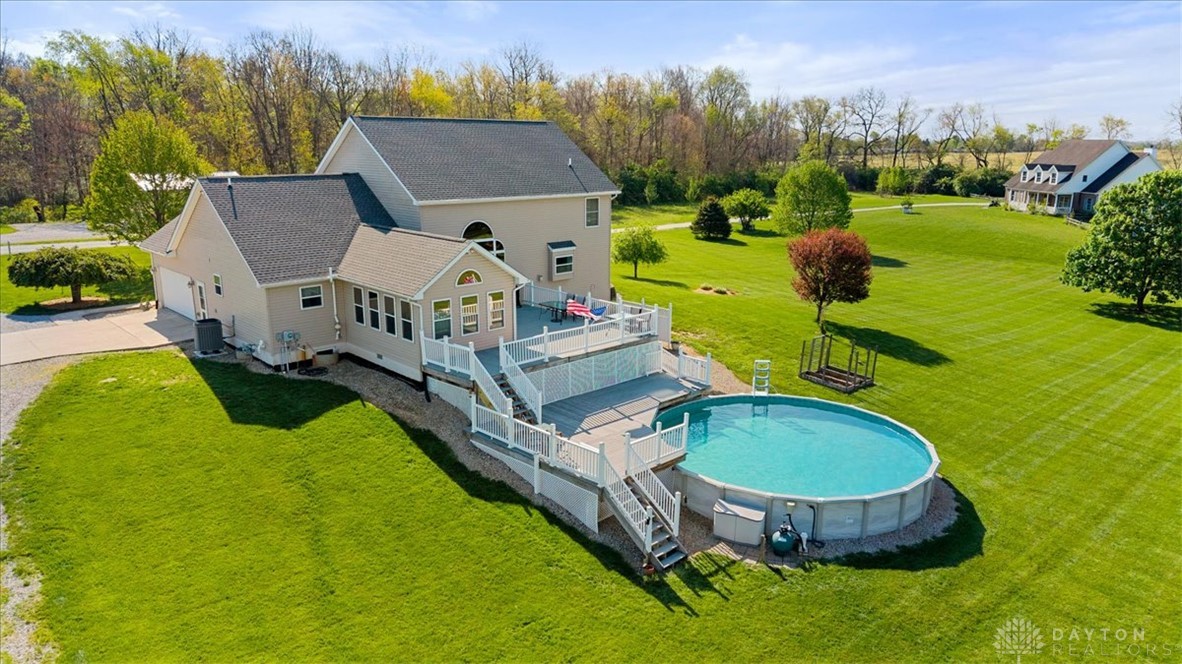 841 Willow Road Springfield, OH 45502 - Photo 53 of 64 Enjoy outdoor living with expansive green space, a multi-level deck, and an above-ground pool.
