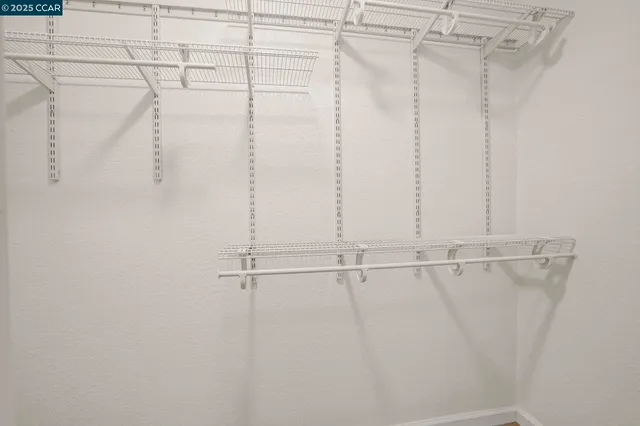 a bathroom with a sink vanity and mirror