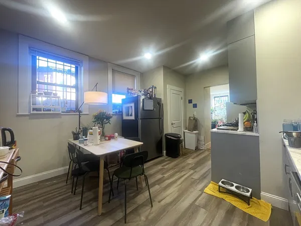 a view of a dining room with furniture and window