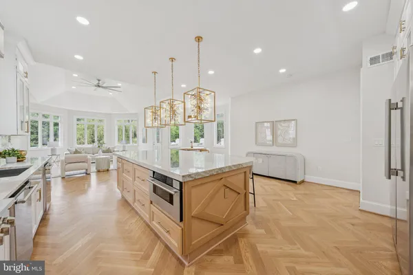 a spacious bedroom with a bed and large windows