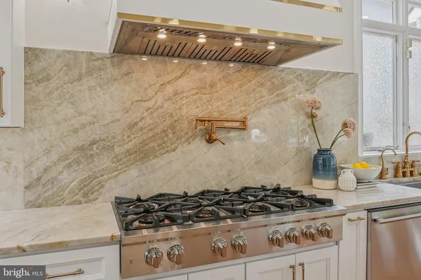 a spacious bedroom with a bed and a couch