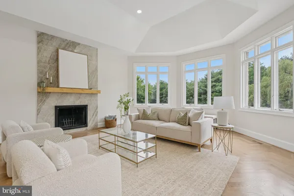 a view of a hallway with wooden floor and stairs