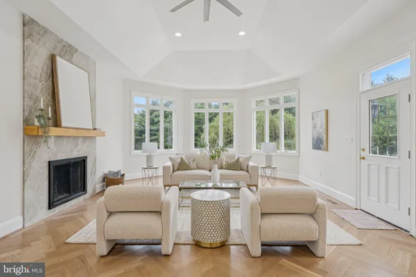 a bedroom with two beds and a large window