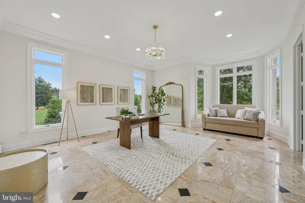 a view of a livingroom with furniture and a potted plant