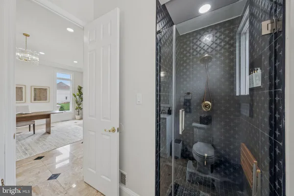a view of a dining room with furniture and a potted plant