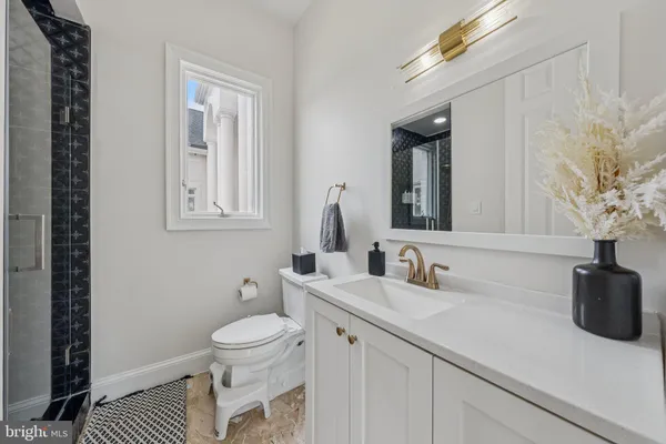 a utility room with sink dryer and washer