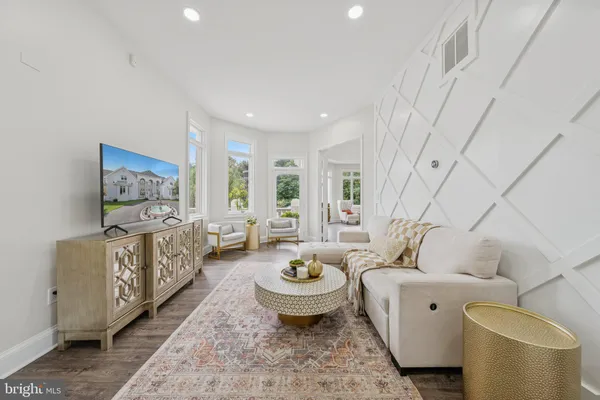 a bathroom with a sink a mirror a vanity and a shower