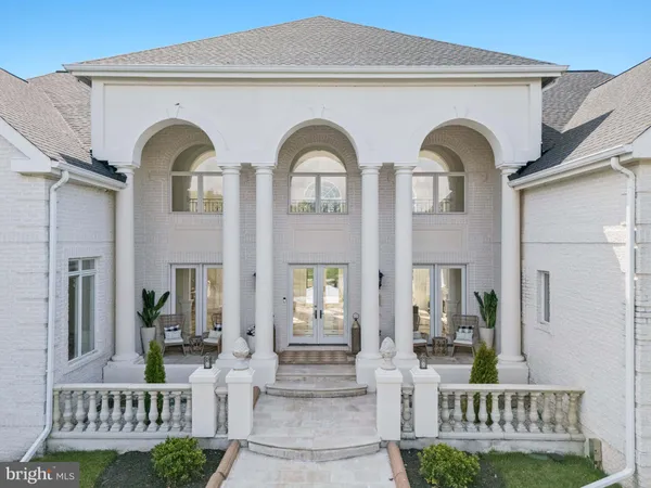 a living room with fireplace furniture and a large window