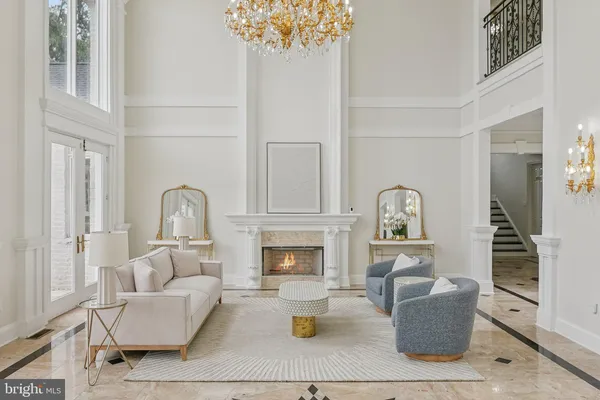 a roof deck with couches and potted plants
