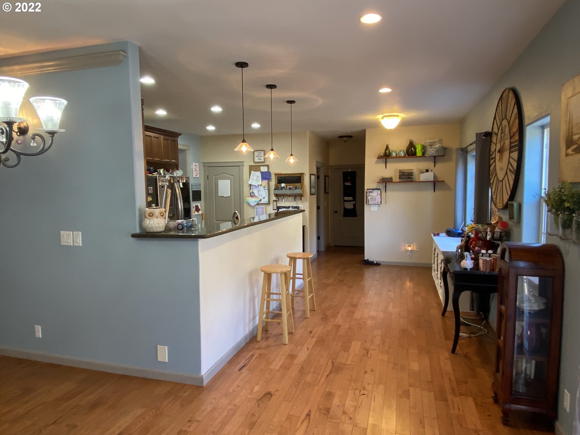 1548 Northeast Rocky Ridge Drive Roseburg, OR 97470 - Photo 11 of 31 a kitchen with stainless steel appliances refrigerator dining table and chairs