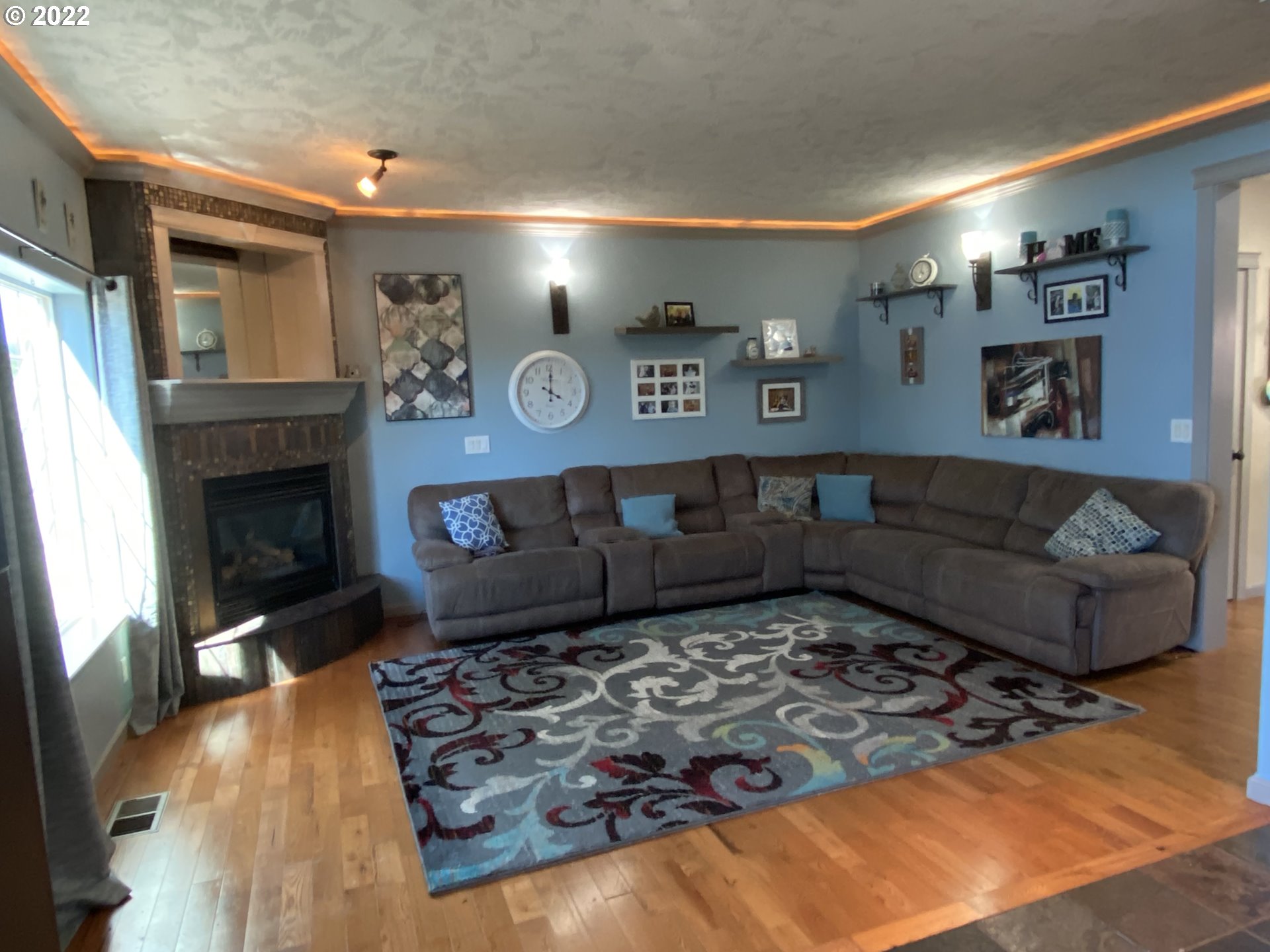 1548 Northeast Rocky Ridge Drive Roseburg, OR 97470 - Photo 13 of 31 a living room with furniture and a fireplace