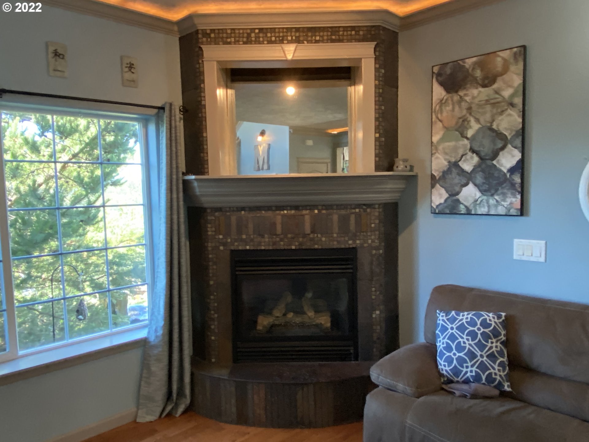 1548 Northeast Rocky Ridge Drive Roseburg, OR 97470 - Photo 15 of 31 a living room with furniture and a fireplace