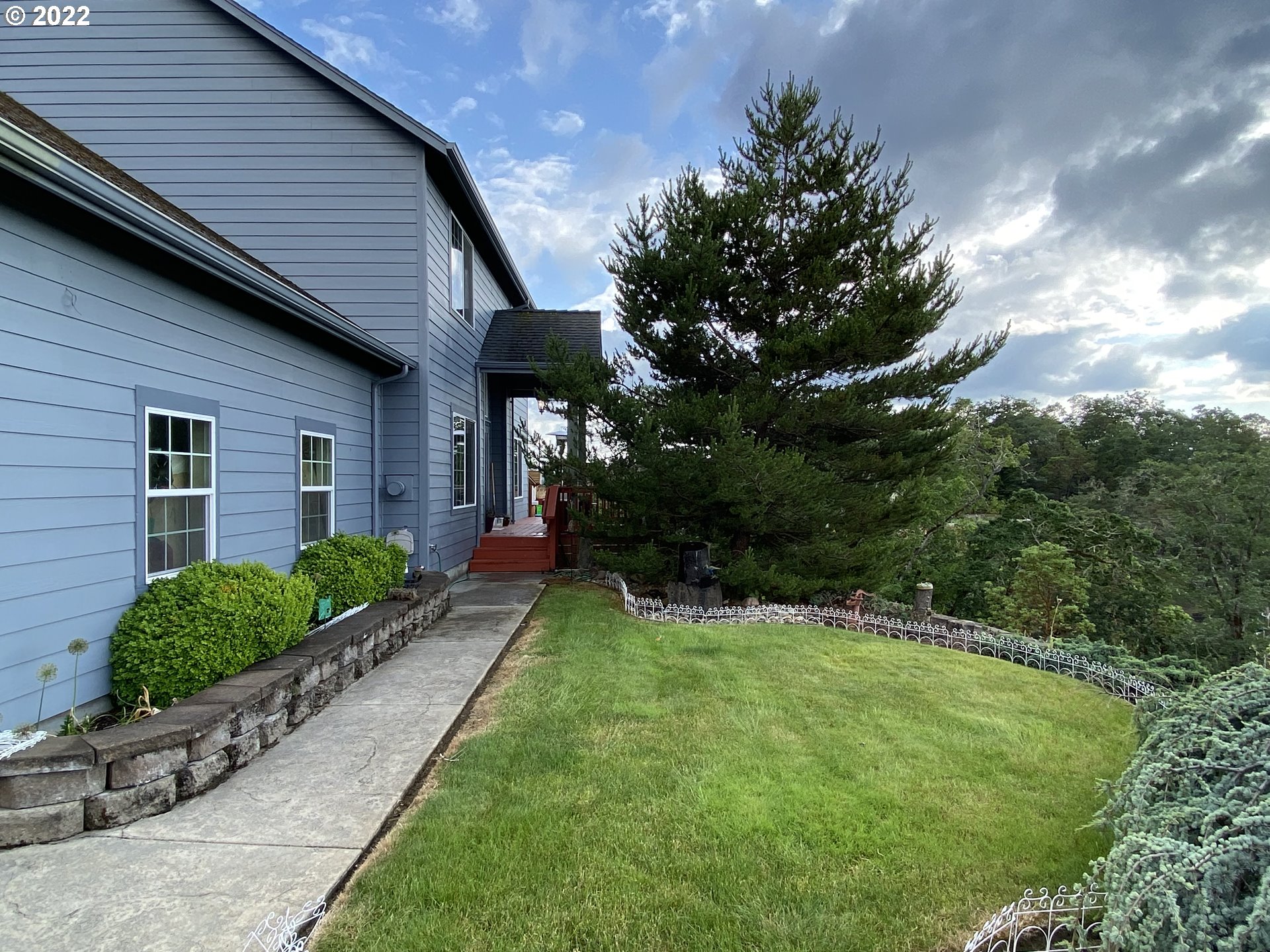 1548 Northeast Rocky Ridge Drive Roseburg, OR 97470 - Photo 5 of 31 a view of a house with a yard