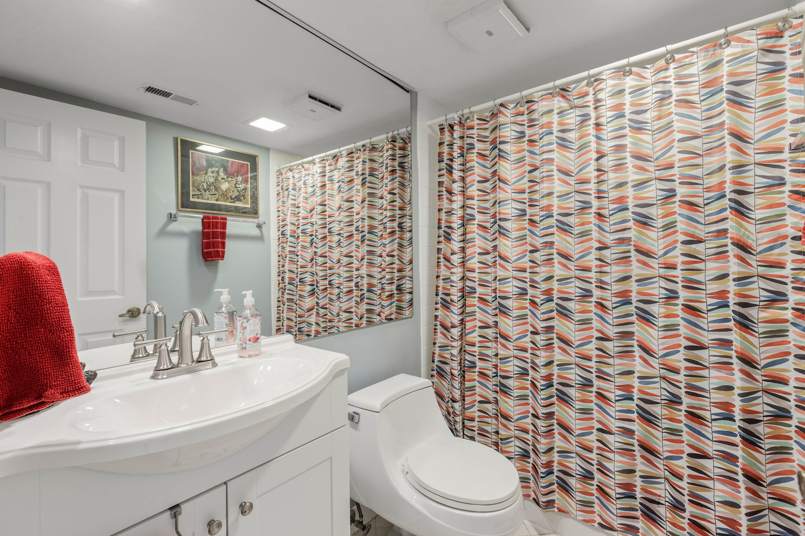 710 Waukegan Road, Unit 201 Glenview, IL 60025 - Photo 15 of 20 a bathroom with a sink toilet and shower