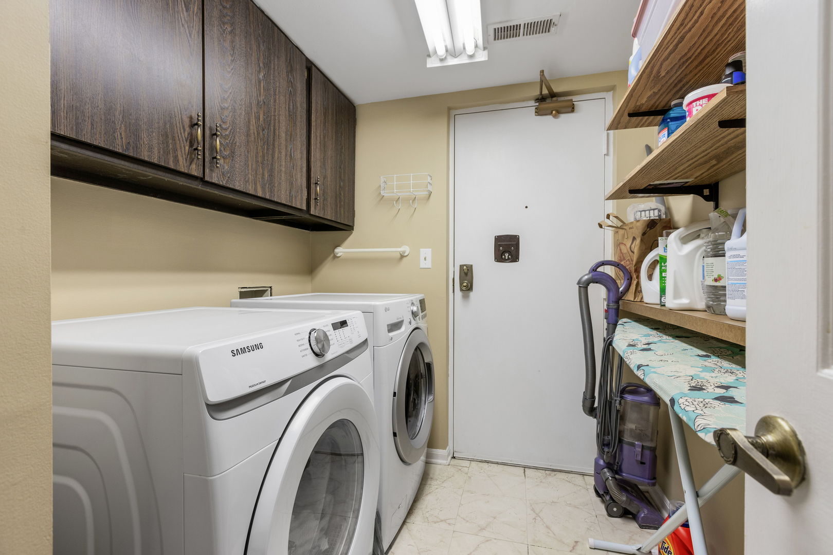 710 Waukegan Road, Unit 201 Glenview, IL 60025 - Photo 16 of 20 a view of storage and utility room with washer and dryer