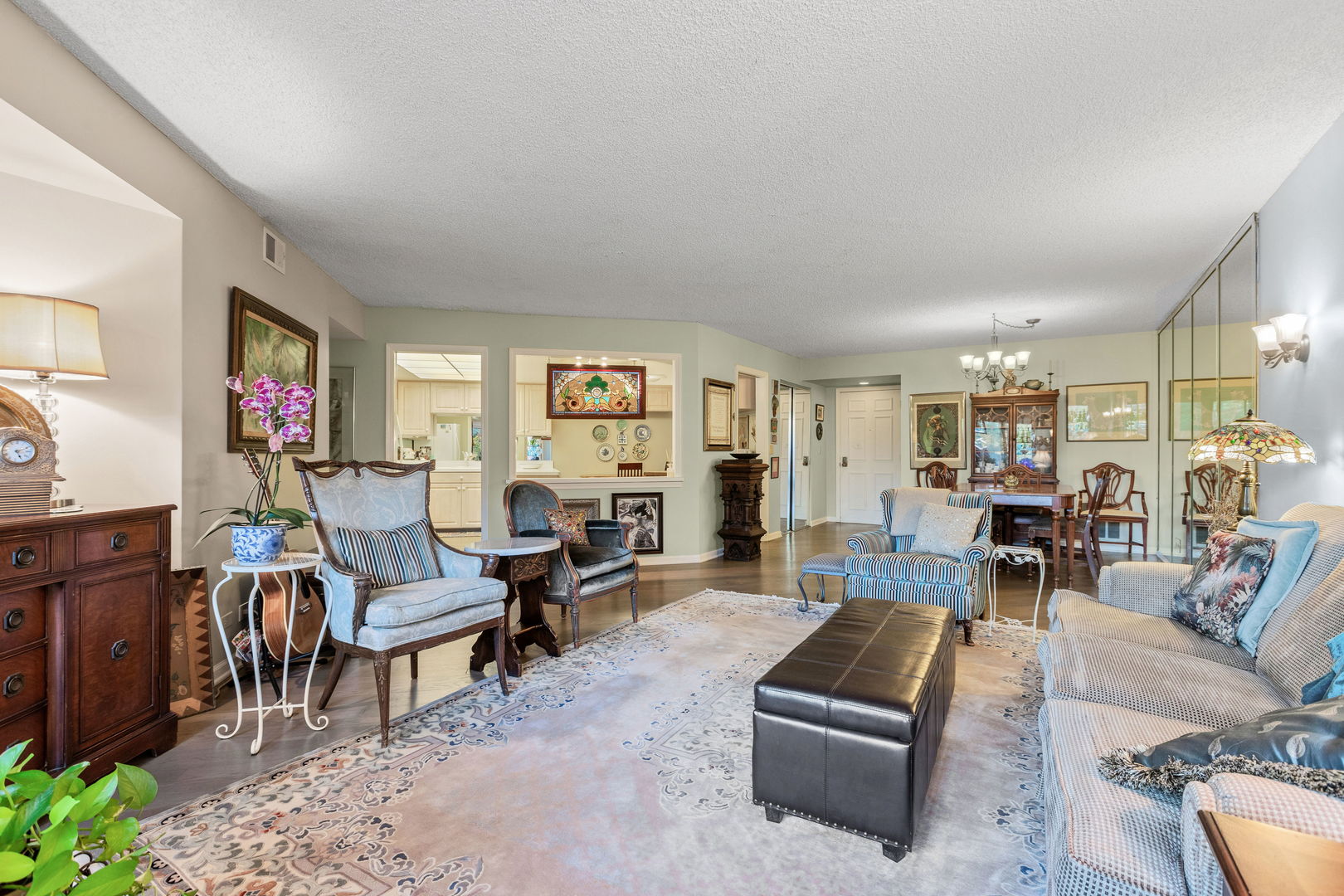 710 Waukegan Road, Unit 201 Glenview, IL 60025 - Photo 4 of 20 a living room with furniture and a wooden floor