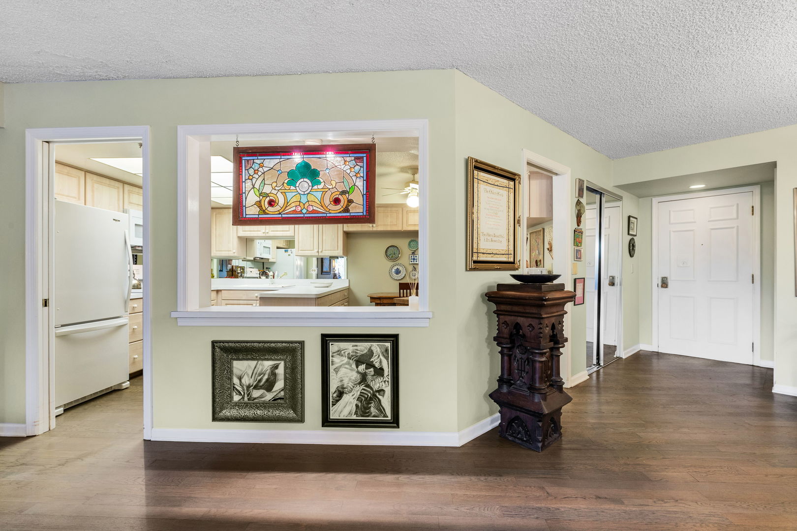 710 Waukegan Road, Unit 201 Glenview, IL 60025 - Photo 7 of 20 a view of kitchen with furniture and wooden floor