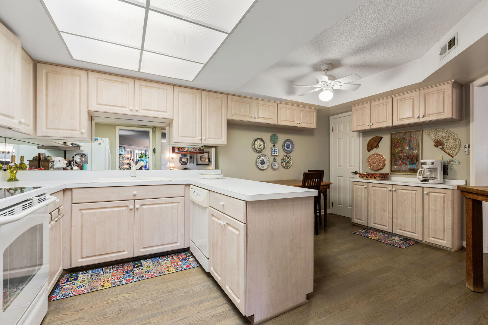 710 Waukegan Road, Unit 201 Glenview, IL 60025 - Photo 9 of 20 a kitchen with white cabinets and white appliances