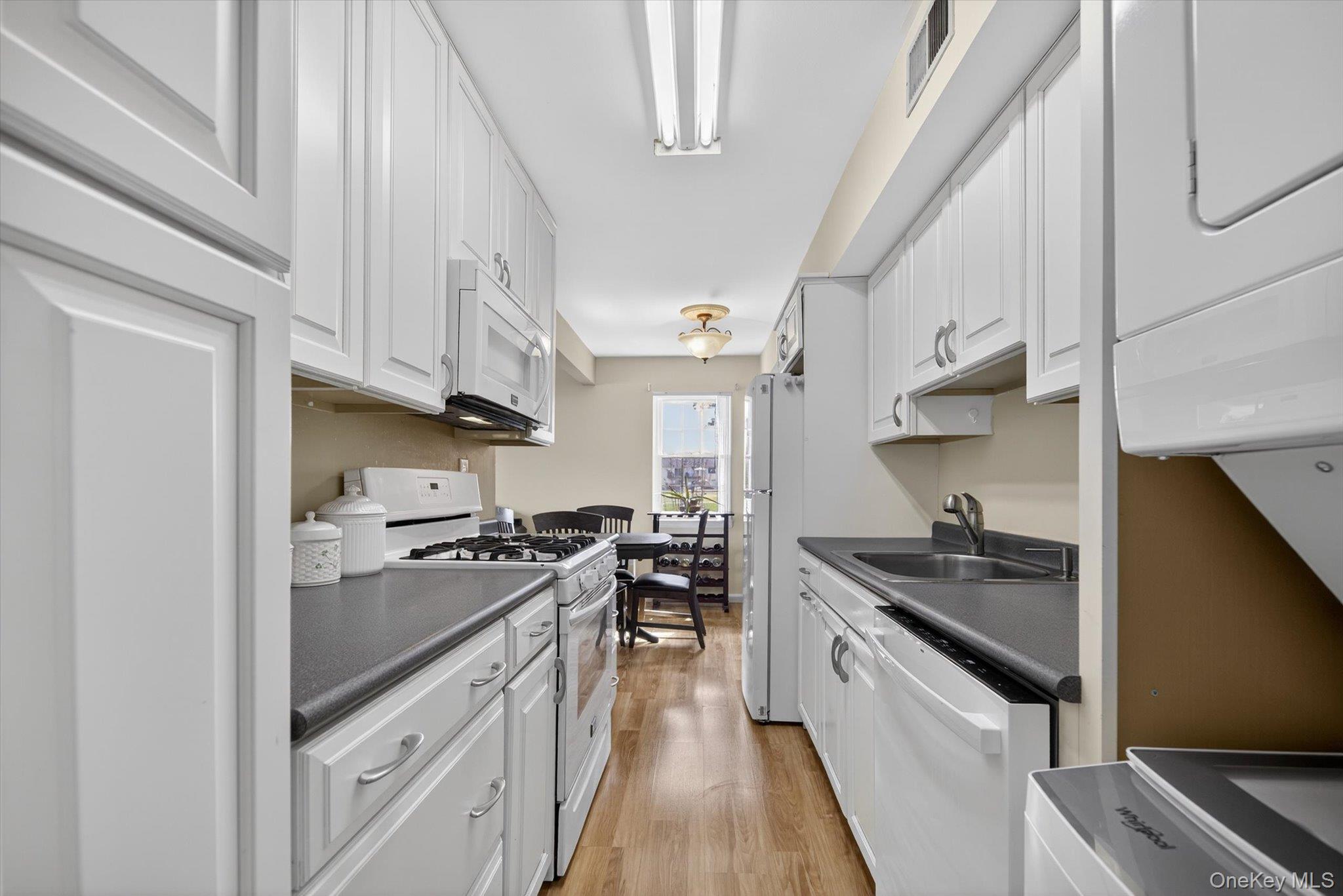 276 Temple Hill Road, Unit 1515 New Windsor, NY 12553 - Photo 11 of 28 a kitchen with stainless steel appliances a sink stove and cabinets