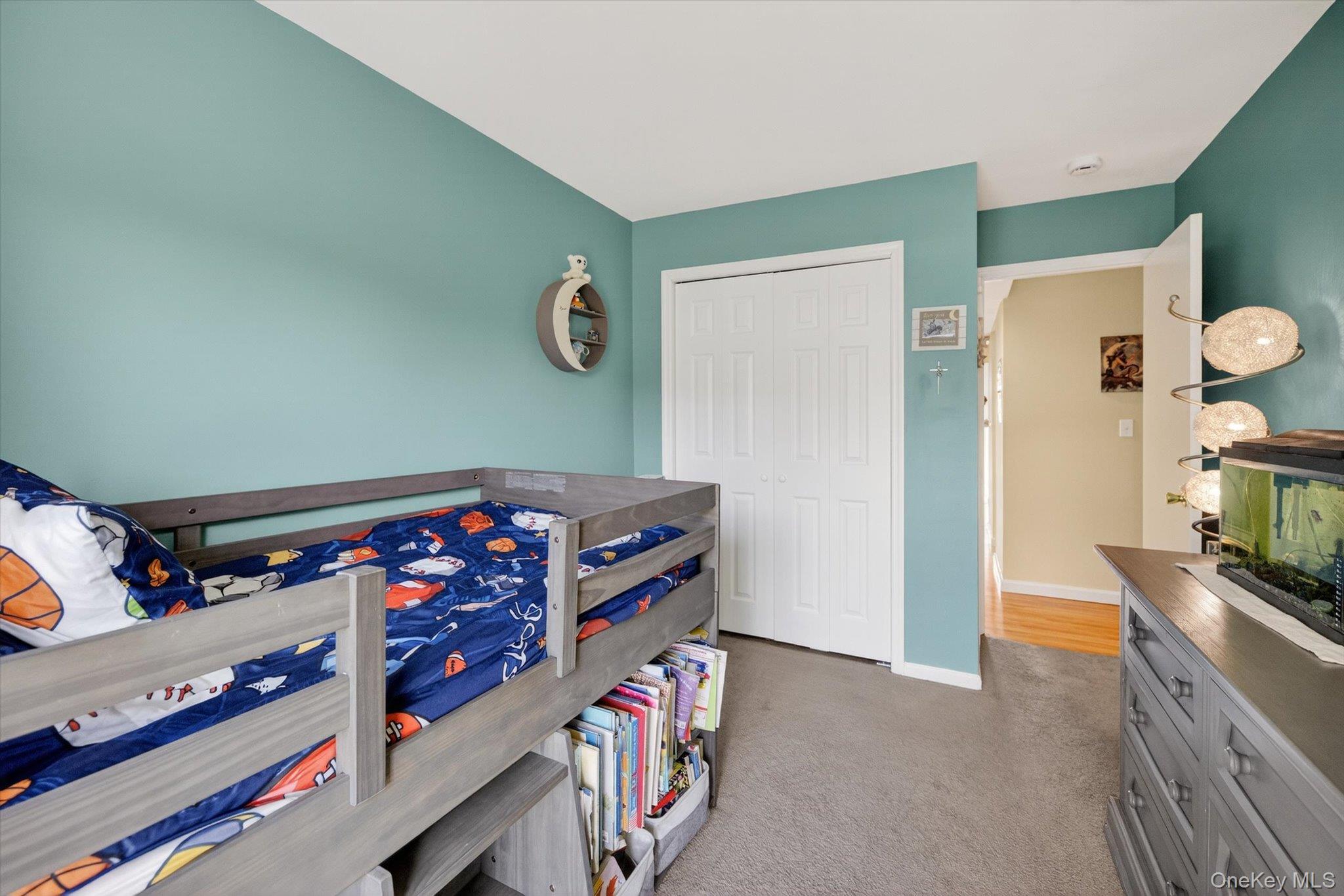 276 Temple Hill Road, Unit 1515 New Windsor, NY 12553 - Photo 14 of 28 a bedroom with furniture and baby crib