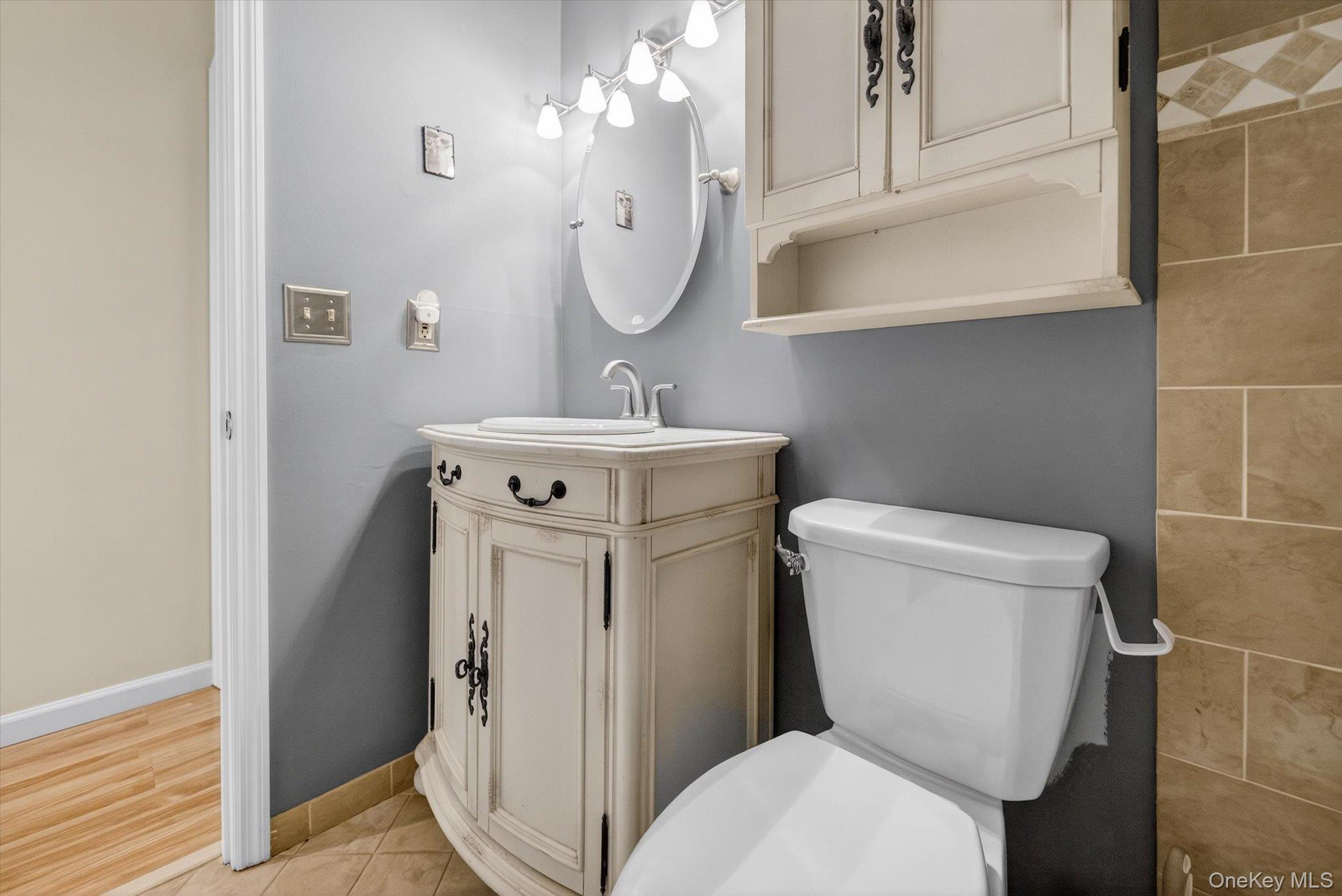 276 Temple Hill Road, Unit 1515 New Windsor, NY 12553 - Photo 16 of 28 a bathroom with a toilet sink and mirror