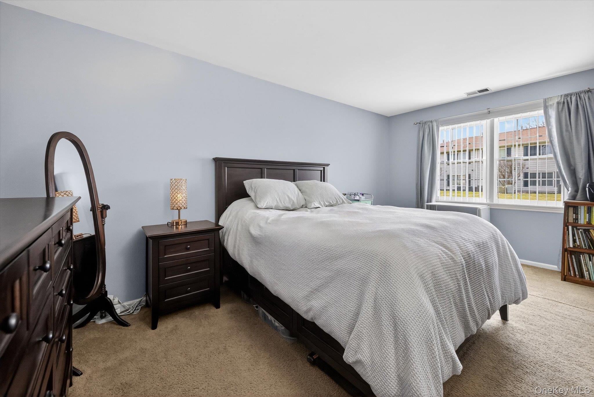 276 Temple Hill Road, Unit 1515 New Windsor, NY 12553 - Photo 17 of 28 a bedroom with bed and a window