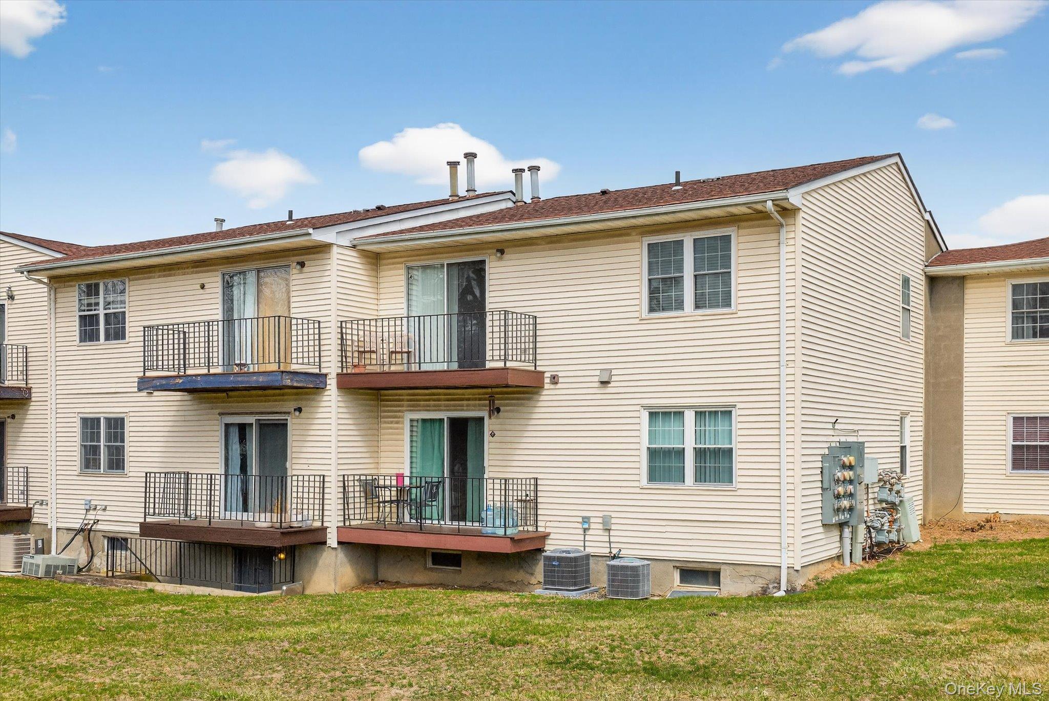 276 Temple Hill Road, Unit 1515 New Windsor, NY 12553 - Photo 22 of 28 a front view of a house with a yard
