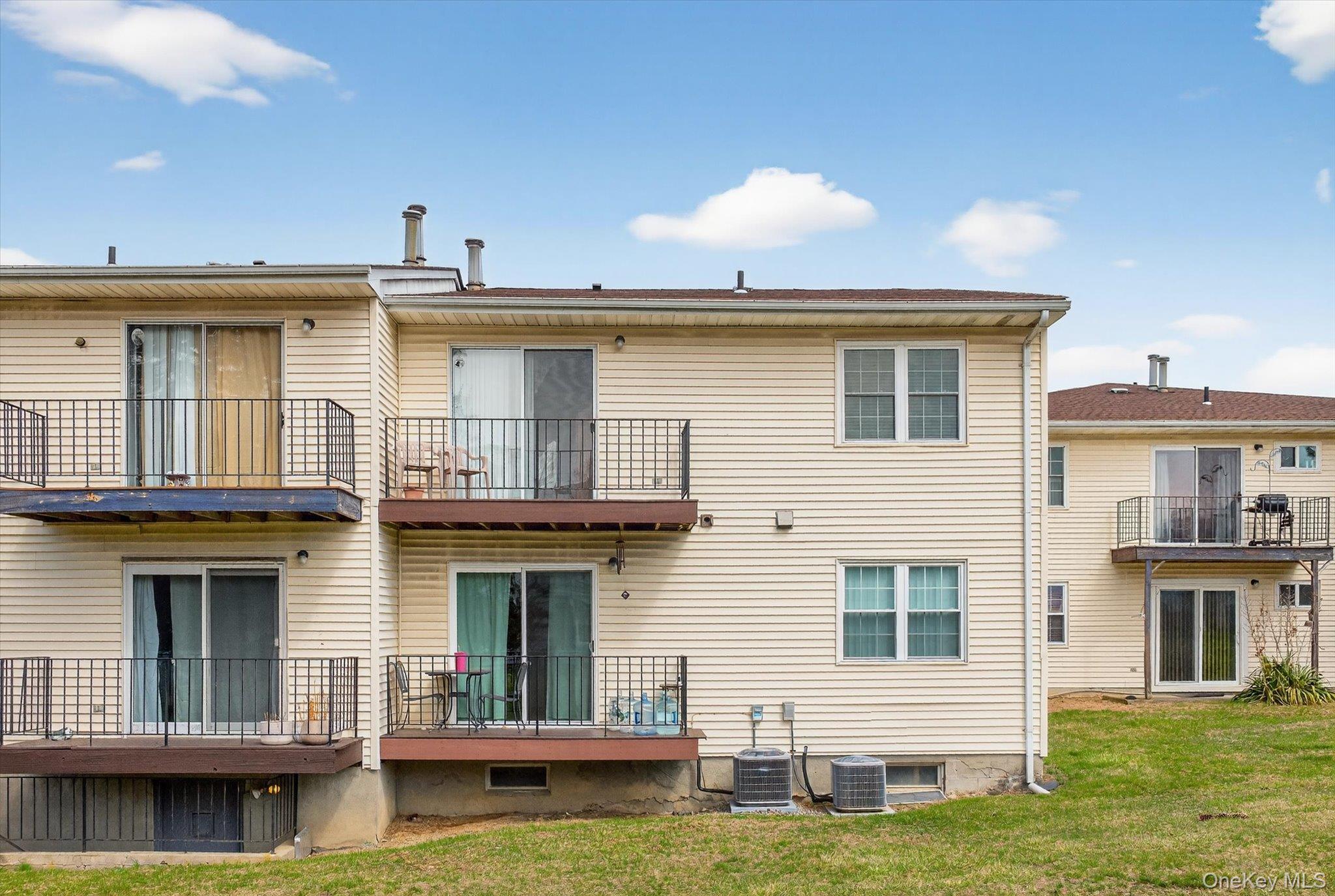 276 Temple Hill Road, Unit 1515 New Windsor, NY 12553 - Photo 23 of 28 a front view of a house with a yard