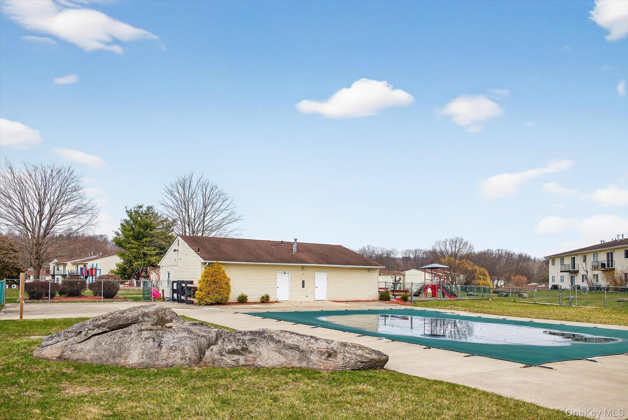 276 Temple Hill Road, Unit 1515 New Windsor, NY 12553 - Photo 25 of 28 a view of a house with swimming pool and a yard
