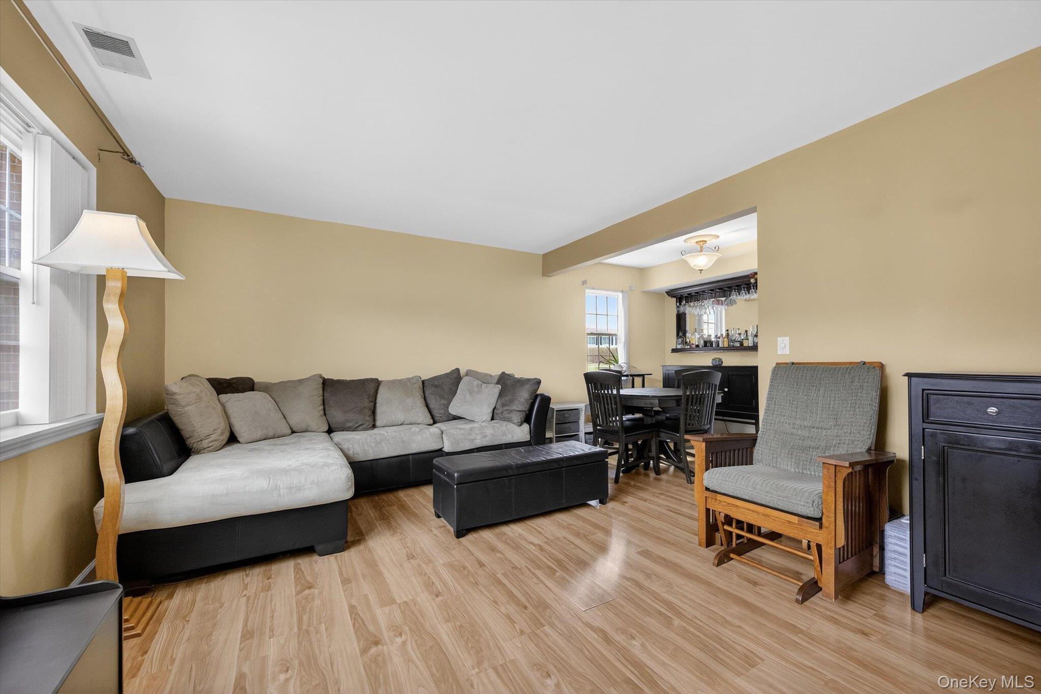 276 Temple Hill Road, Unit 1515 New Windsor, NY 12553 - Photo 3 of 28 a living room with furniture and a wooden floor