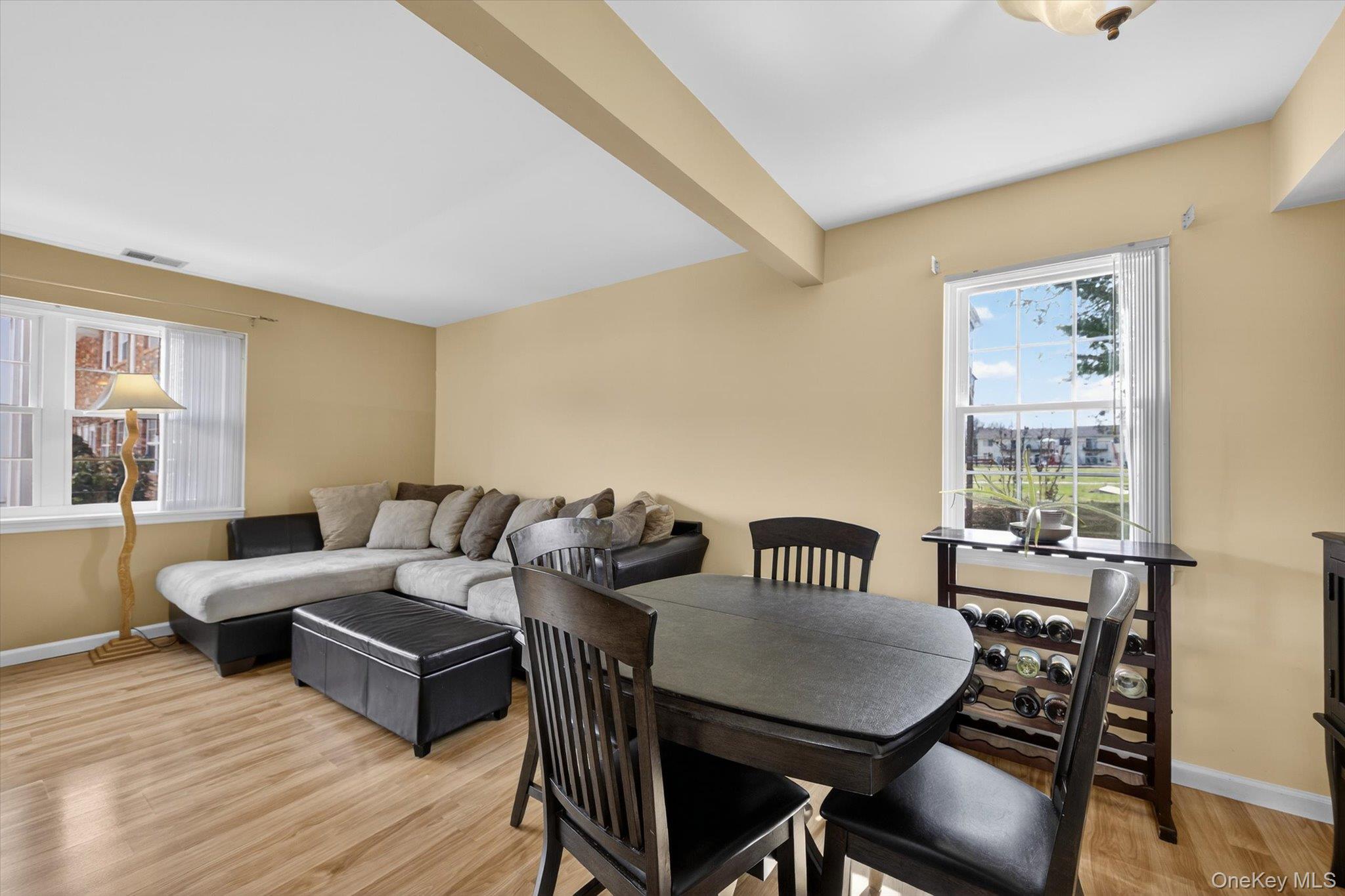 276 Temple Hill Road, Unit 1515 New Windsor, NY 12553 - Photo 5 of 28 a view of a livingroom with furniture and a dining table with wooden floor