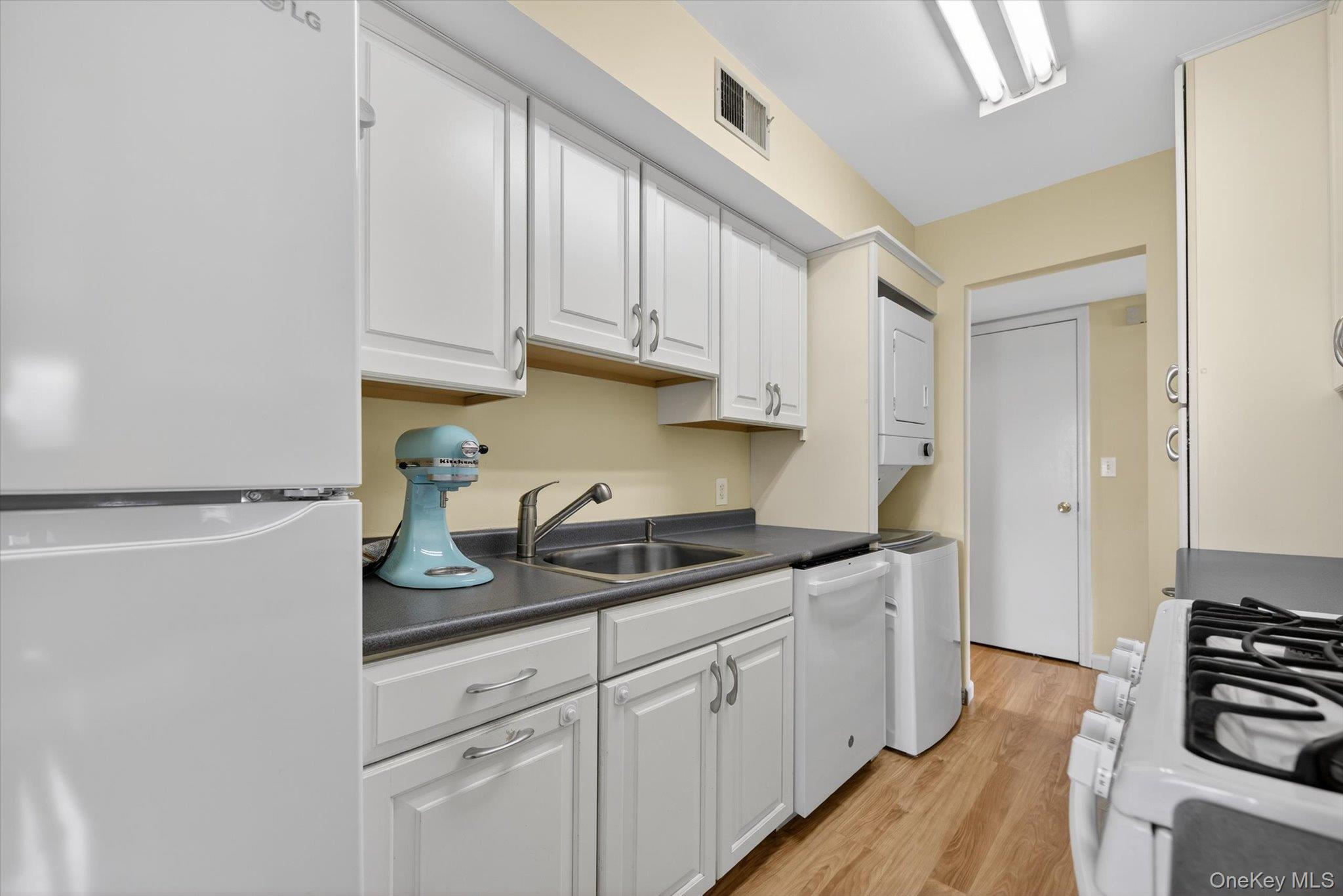276 Temple Hill Road, Unit 1515 New Windsor, NY 12553 - Photo 8 of 28 a kitchen with stainless steel appliances granite countertop a sink stove and cabinets