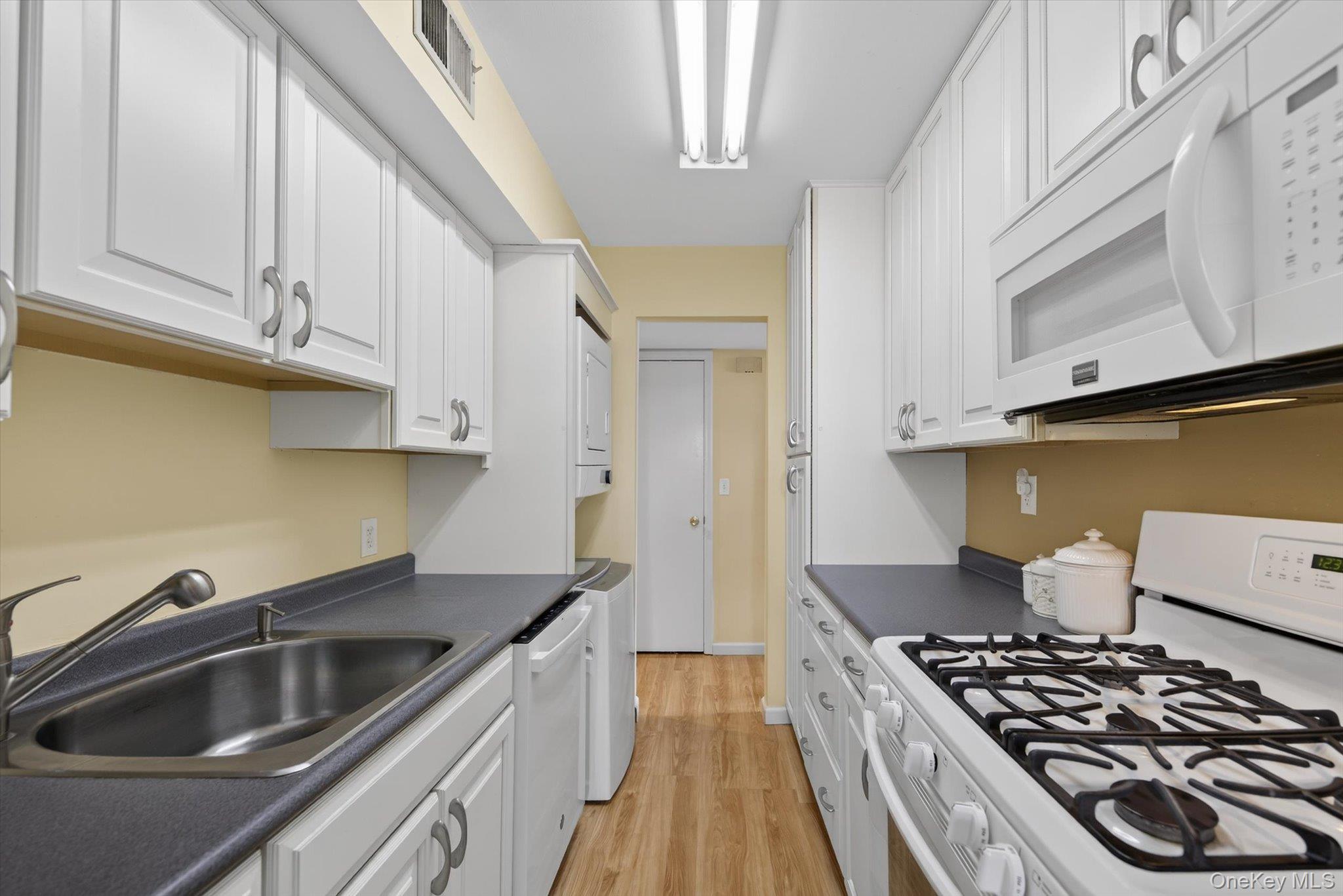 276 Temple Hill Road, Unit 1515 New Windsor, NY 12553 - Photo 9 of 28 a kitchen with a sink and a stove top oven