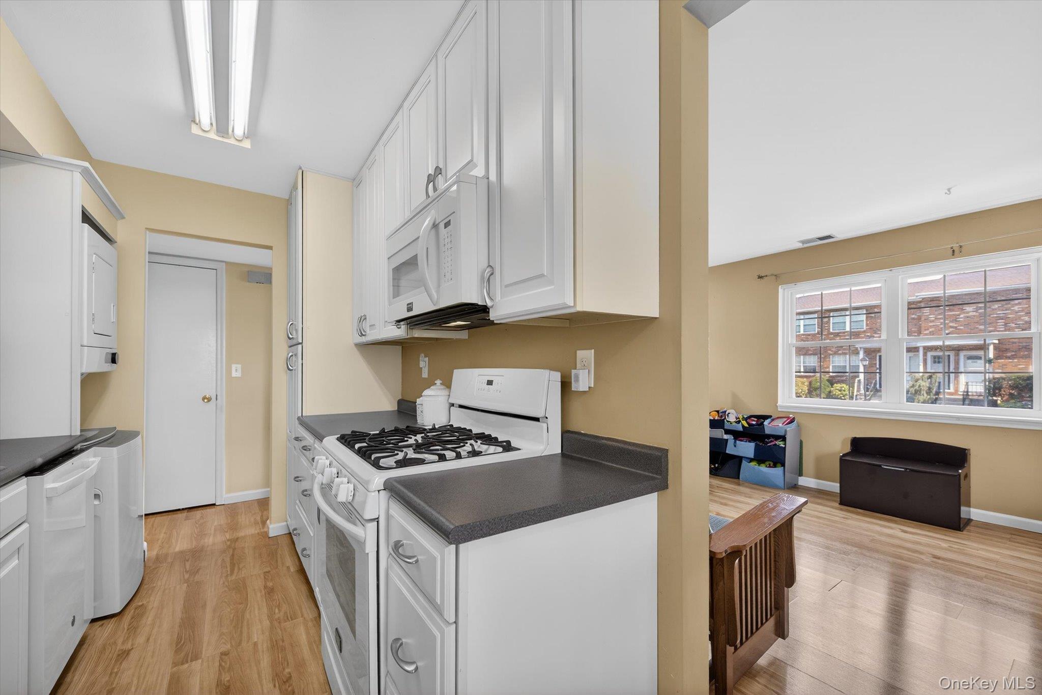 276 Temple Hill Road, Unit 1515 New Windsor, NY 12553 - Photo 10 of 28 a kitchen with stainless steel appliances a stove a sink and a microwave
