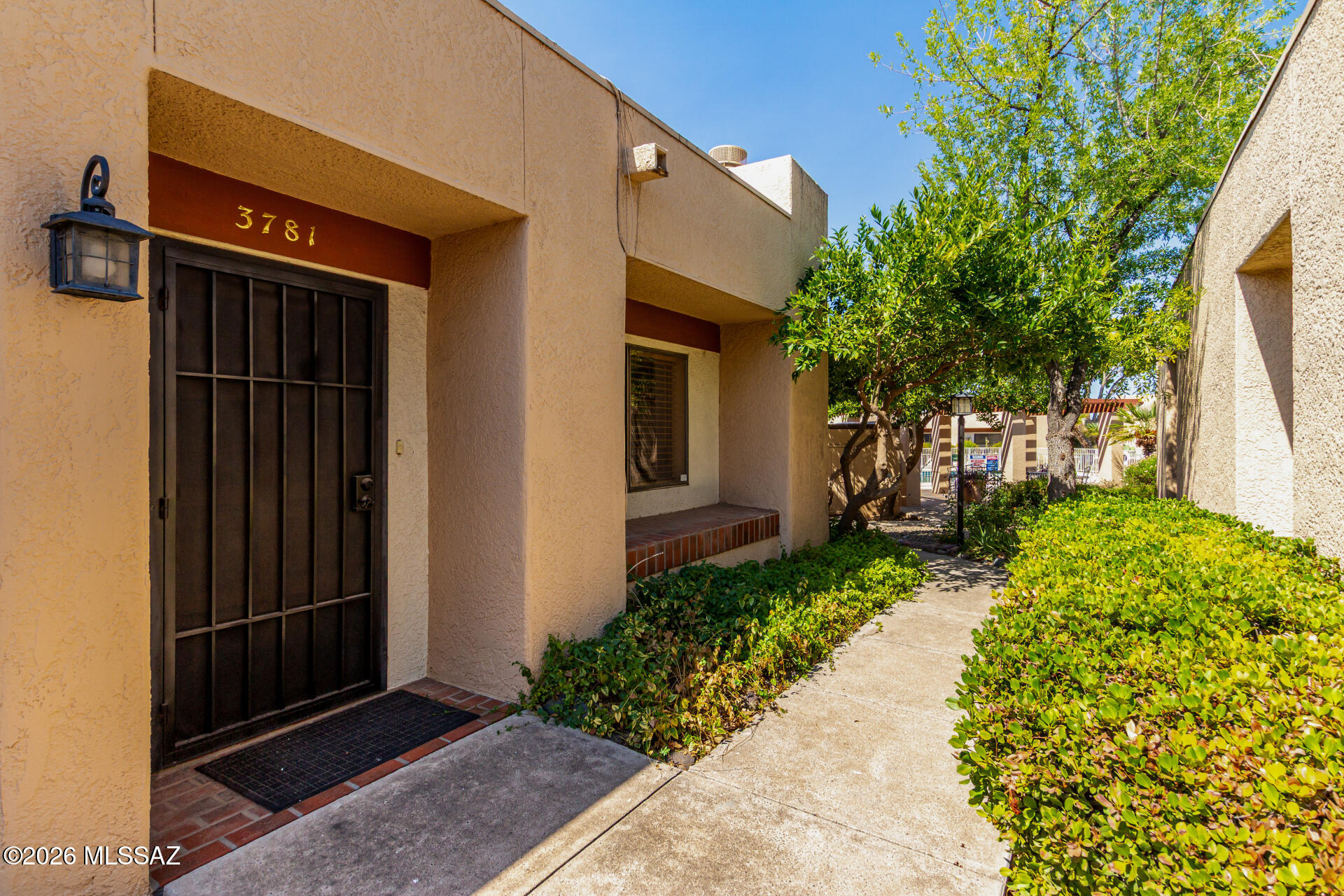 3781 East Edison Street Tucson, AZ 85716 - Photo 3 of 28 a front view of a house with garden