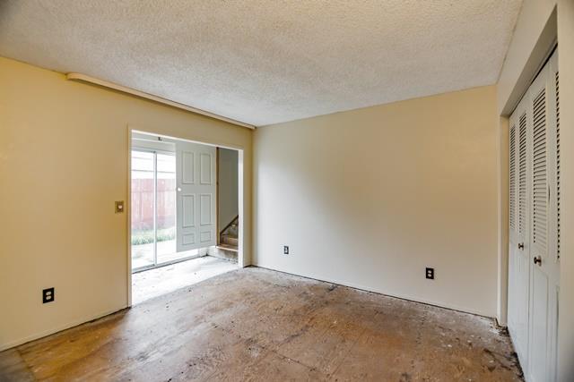 1500 Soto Street Seaside, CA 93955 - Photo 17 of 30 a view of an empty room with wooden floor and a window