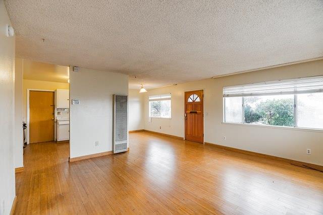 1500 Soto Street Seaside, CA 93955 - Photo 21 of 30 an empty room with wooden floor and windows