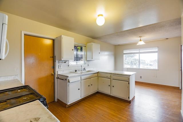 1500 Soto Street Seaside, CA 93955 - Photo 27 of 30 a kitchen with sink stove and refrigerator