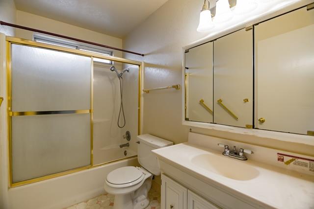 1500 Soto Street Seaside, CA 93955 - Photo 30 of 30 a bathroom with a sink a mirror a toilet and shower