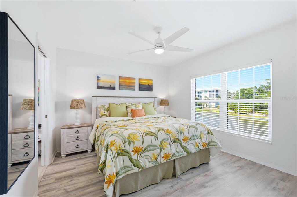 8405 Placida Road, Unit 204 Placida, FL 33946 - Photo 25 of 49 a bedroom with a bed and a window