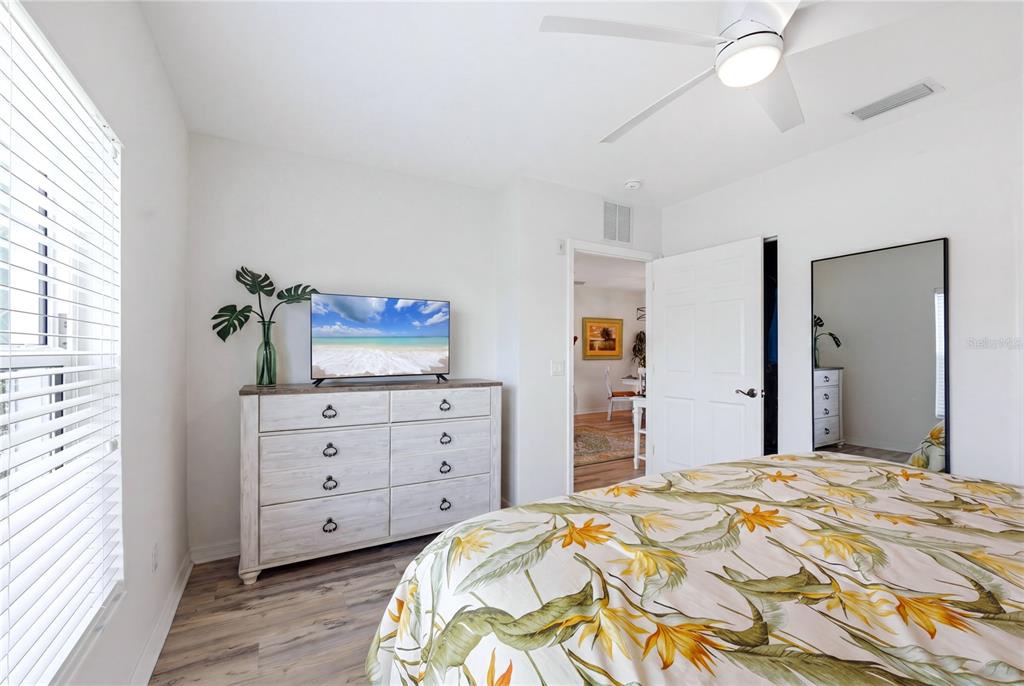 8405 Placida Road, Unit 204 Placida, FL 33946 - Photo 27 of 49 a bedroom with a bed and a dresser