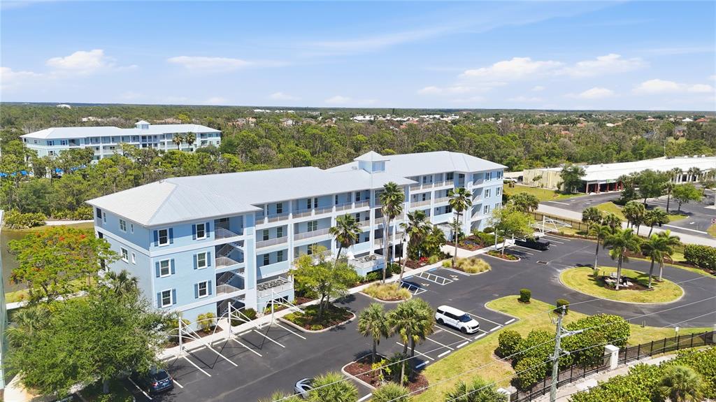 8405 Placida Road, Unit 204 Placida, FL 33946 - Photo 4 of 49 an aerial view of a building with garden space and ocean view