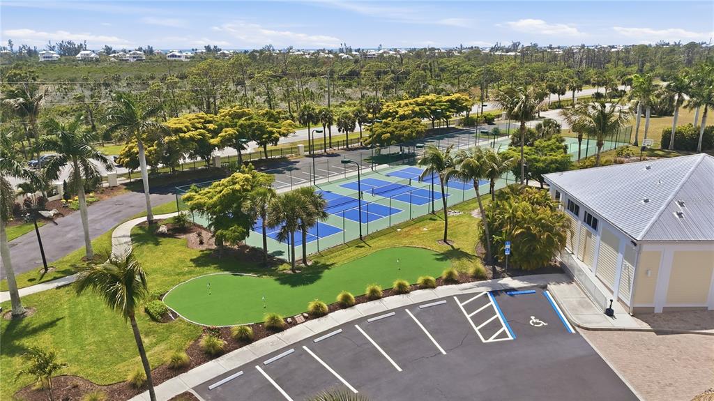 8405 Placida Road, Unit 204 Placida, FL 33946 - Photo 42 of 49 an aerial view of residential houses with outdoor space and trees