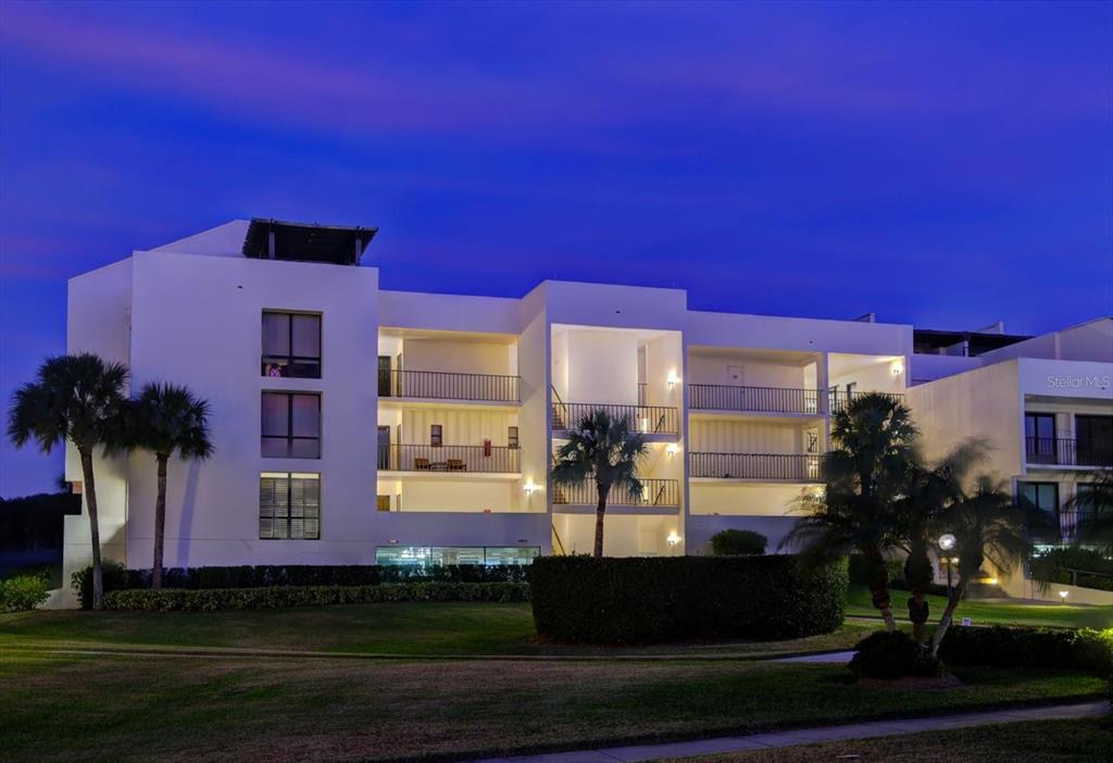 50 Coe Road, Unit 311 Belleair, FL 33756 - Photo 2 of 53 a front view of a house with a yard