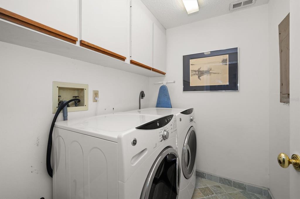 50 Coe Road, Unit 311 Belleair, FL 33756 - Photo 32 of 53 a utility room with dryer and washer