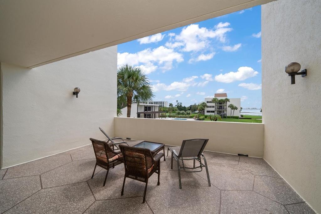 50 Coe Road, Unit 311 Belleair, FL 33756 - Photo 37 of 53 a view of a terrace with furniture and a view of backyard