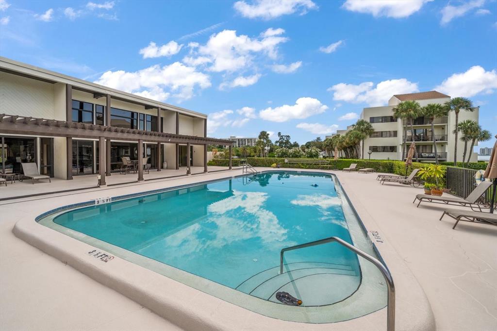 50 Coe Road, Unit 311 Belleair, FL 33756 - Photo 52 of 53 a view of a swimming pool with a patio